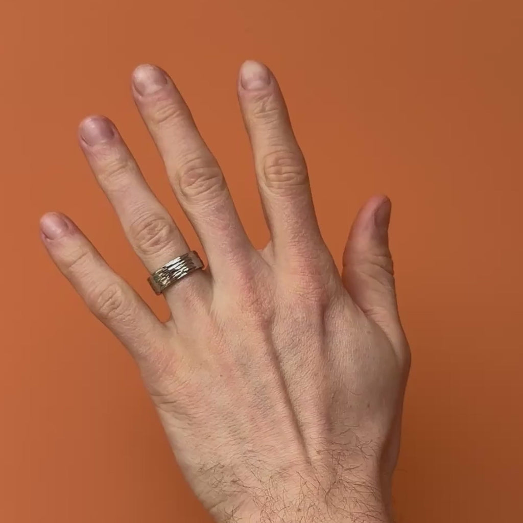 Video of hammered stainless steel ring on a hand. By Bound.